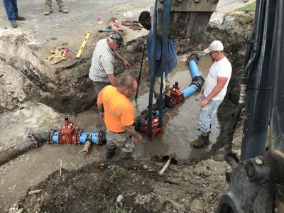 GEC employees performing water remediation